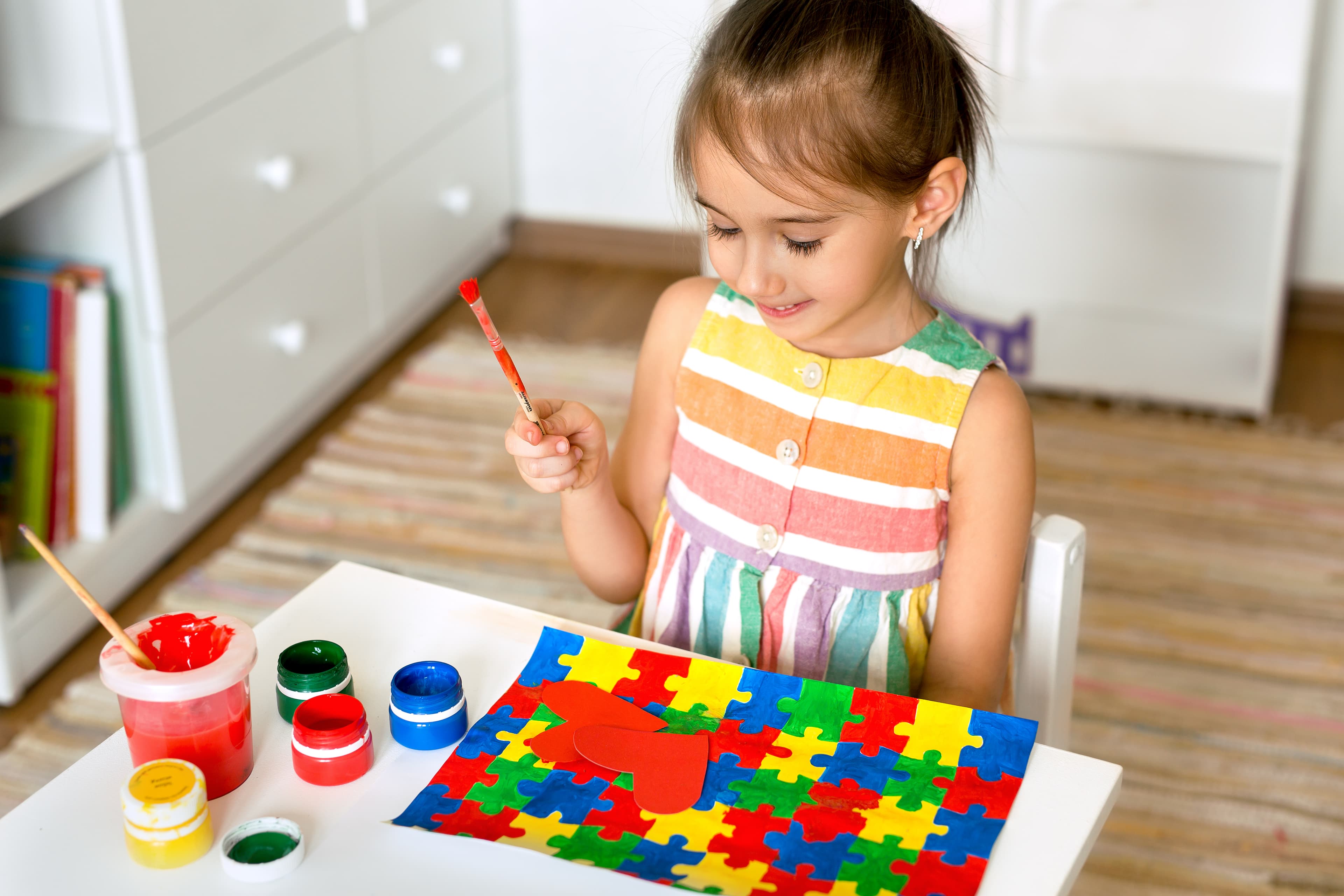 Girl with art therapy materials